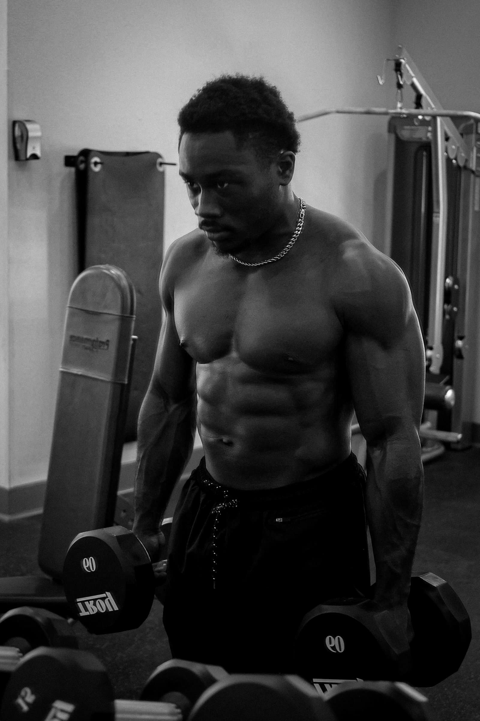 Adam Kia training with dumbbells